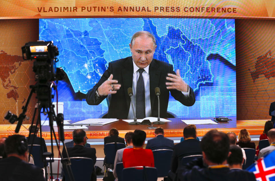 Russian President Vladimir Putin gestures as he speaks via video call during a news conference in Moscow, Russia, Thursday, Dec. 17, 2020. This year, Putin attended his annual news conference online due to the coronavirus pandemic. (AP Photo/Alexander Zemlianichenko)