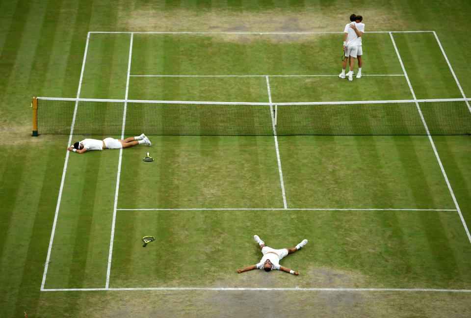 LONDON, ENGLAND - JULY 13: Sebastian Cabal of Colombia and playing partner Juan Robert Farah of Colombia celebrate match point in their Men's Doubles final against Nicolas Mahut of France and Edouard Roger-Vasselin of France during Day twelve of The Championships - Wimbledon 2019 at All England Lawn Tennis and Croquet Club on July 13, 2019 in London, England. (Photo by Matthias Hangst/Getty Images)