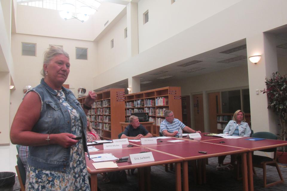 West Holmes treasurer Jamie Mullet explains the district's plan to reallocate operating funds to permanent improvement funds in order to construct a new elementary school without raising taxes.