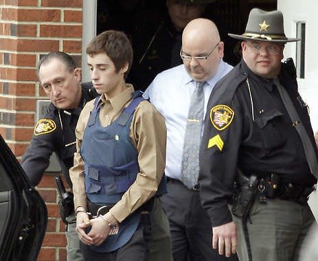 Seventeen-year-old T.J. Lane is led from juvenile court by sheriff’s deputies Tuesday in Chardon, Ohio, after his arraignment. Mark Duncan | Associated Press