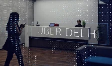 An employee walks inside the office of ride-hailing service Uber in Gurugram, previously known as Gurgaon, on the outskirts of New Delhi, April 19, 2016. REUTERS/Anindito Mukherjee