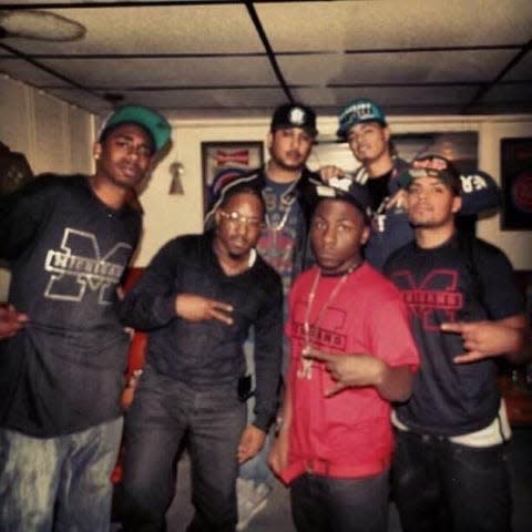 Quinton "Black Hefner" Kittles, far left, and Curshawn "LaKaz" Terrell, in glasses, are pictured in 2012 in Flint, Michigan, at an event.