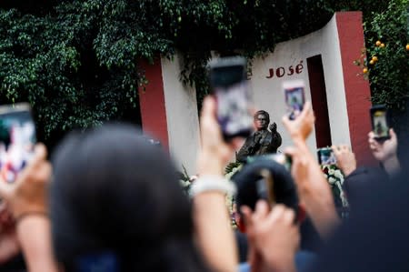 Neighbors and fans pay tribute to Mexican singer and songwriter Jose Jose, who died in Miami after complications following treatment for pancreatic cancer, at his statue in his neighborhood in Mexico City