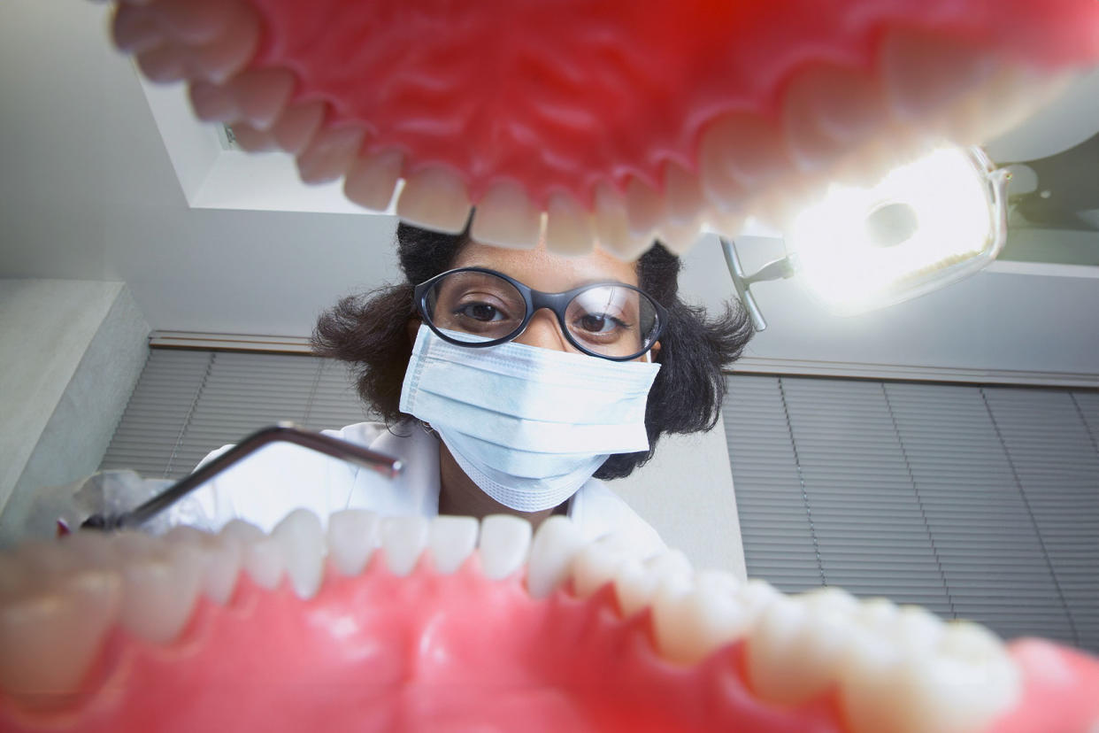 Dentist inside mouth Getty Images/Kris Timken