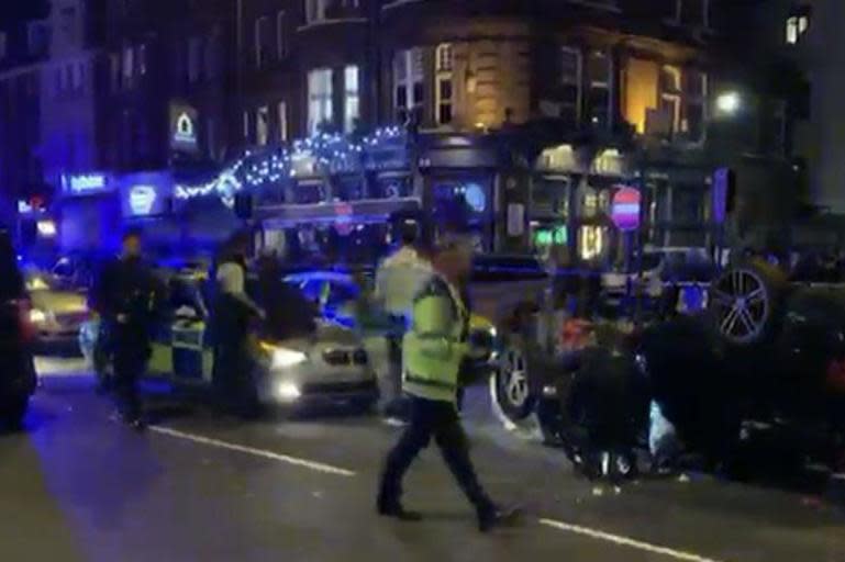 A car overturned following the three-vehicle crash (@999london/Twitter)