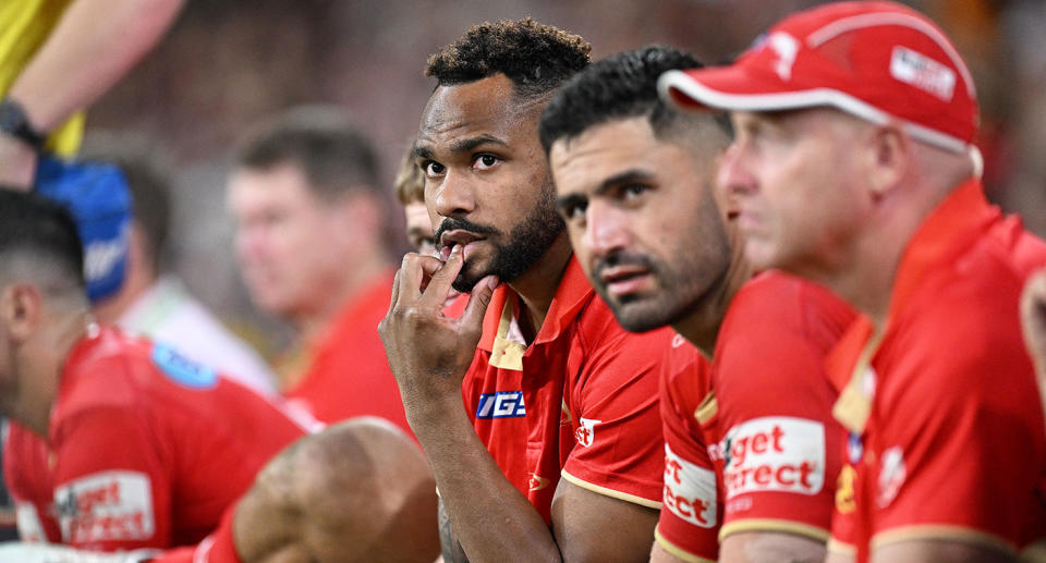 Pictured here, incumbent Maroons centre Hamiso Tabuai-Fidow on the NRL sidelines for the Dolphins.