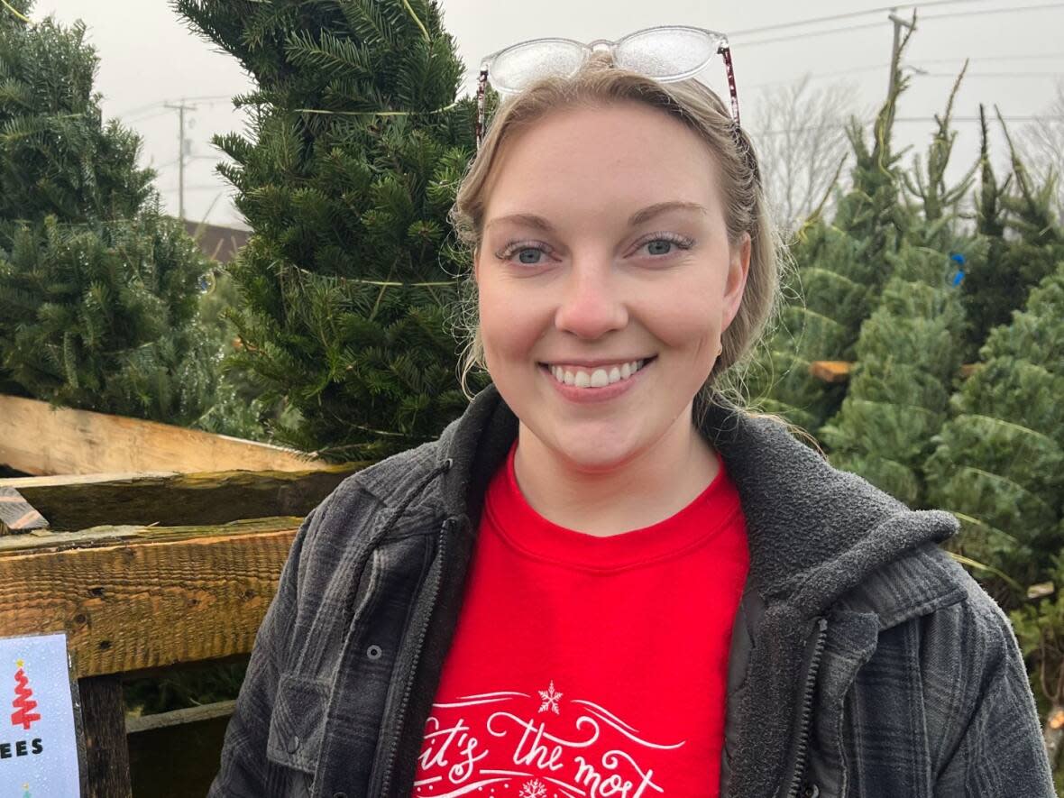 Amy Molloy says the Nova Scotia trees for sale at Lester's Farm were more expensive to bring in this year, so they're more expensive to buy as well. (Zach Goudie/CBC - image credit)