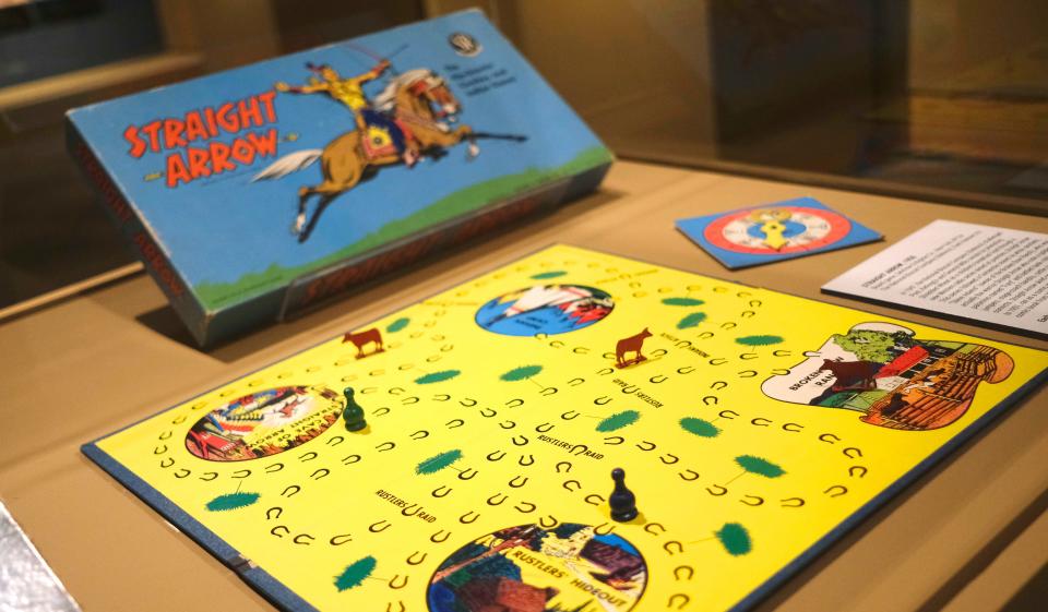 The 1950 board game "Straight Arrow" is on view in the National Cowboy & Western Heritage Museum exhibit "Playing Cowboy" Friday, March 24, 2023, in Oklahoma City. On view through May 7, "Playing Cowboy" showcases Western books, costumes and toys for children.