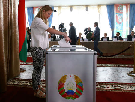 A woman casts her ballot during a parliamentary election at a polling station in Minsk, Belarus September 11, 2016. REUTERS/Vasily Fedosenko