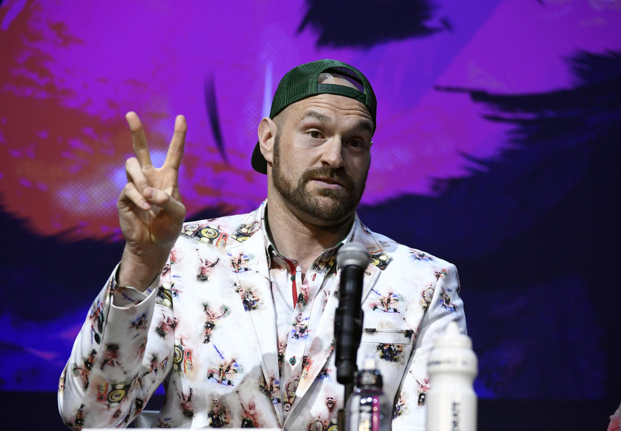 LOS ANGELES, CA - JANUARY 13: Tyson Fury flashes number two as he says he will knockout Deontay Wilder in two rounds during a news conference with  at The Novo Theater at L.A. Live on January 13, 2020 in Los Angeles, California. (Photo by Kevork Djansezian/Getty Images)