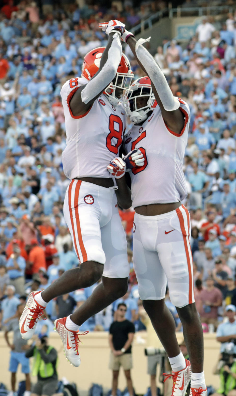 Clemson's Tee Higgins (5) celebrates his touchdown with Justyn Ross (8) during the fourth quarter of an NCAA college football game against North Carolina in Chapel Hill, N.C., Saturday, Sept. 28, 2019. (AP Photo/Chris Seward)