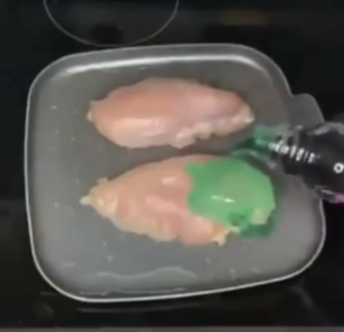 A person cooks chicken breast in liquid cold medicine. (Youtube/Willeezy Entertainment)