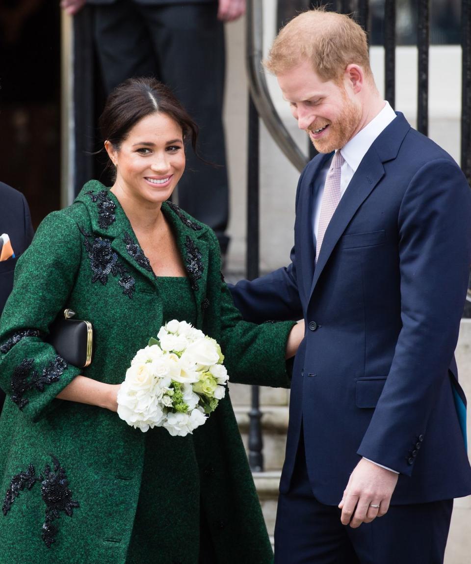 <p>Harry helps Meghan down the steps at Canada House after attending a Commonwealth Day Youth Event in London.</p>