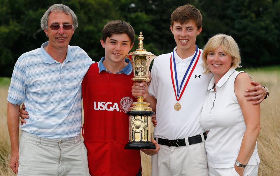  Matt Fitzpatrick of England holds the Havemeyer trophy with father Russell, his brother Alex Fitzpatrick, and his mother Sue after hewinning the 2013 U.S. Amateur Championship at The Country Club on August 18, 2013 in Brookline, Massachusetts - GETTY IMAGES