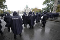 Serbian riot policemen line up to prevent anti-gay protesters from clashing with participants in the European LGBTQ pride march march in Belgrade, Serbia, Saturday, Sept. 17, 2022. Amid mounting tensions, police were deployed Saturday in downtown Belgrade where a Pride march was expected to be held despite threats from anti-gay groups and an official earlier ban. (AP Photo/Darko Vojinovic)