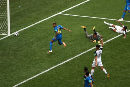 Soccer Football - World Cup - Group E - Brazil vs Costa Rica - Saint Petersburg Stadium, Saint Petersburg, Russia - June 22, 2018 Brazil's Neymar scores their second goal as Costa Rica's Keylor Navas looks on REUTERS/Lee Smith