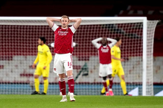 Rob Holding stands dejected as Villarreal beat Arsenal