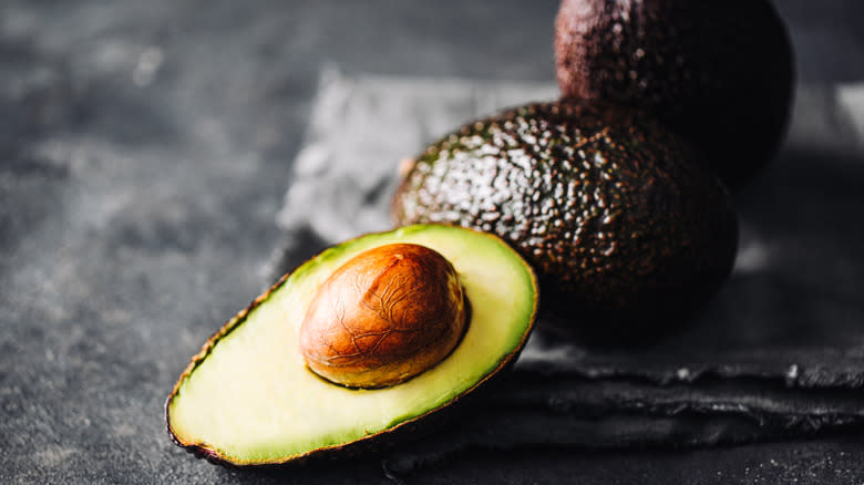 ripe avocado on black background