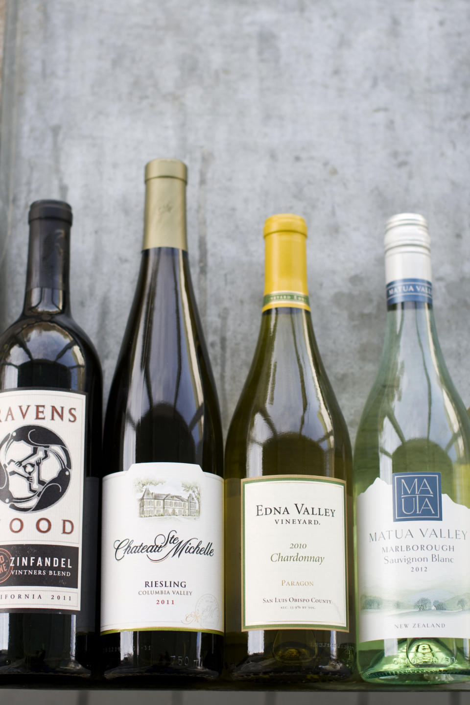 This image taken on April 29, 2013 shows, from left, Ravenswood Zinfandel, Chateau St. Michelle Eroica Riesling, Edna Valley Chardonnay and Matua Valley Sauvignon Blanc wines in Concord, N.H. (AP Photo/Matthew Mead)