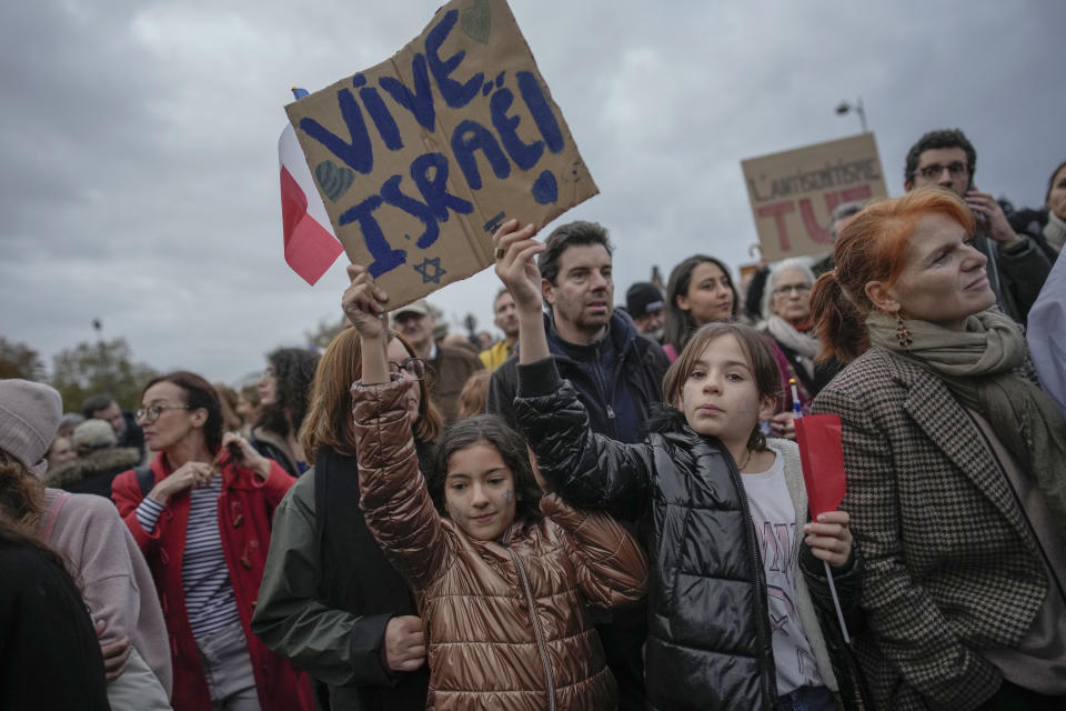 Thousands gather for a march against antisemitism in Paris, France, Sunday, Nov. 12, 2023. French authorities have registered more than 1,000 acts against Jews around the country in a month since the conflict in the Middle East began. (AP Photo/Christophe Ena)