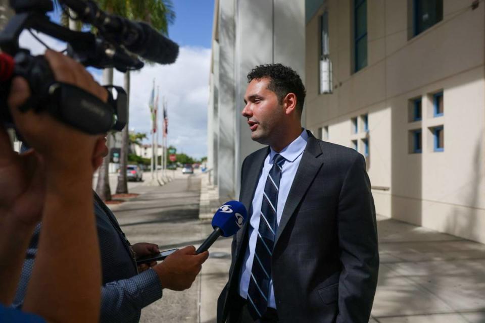 Hialeah Councilman Bryan Calvo, center, talks to the press with his legal team, Attorney Brittany Quintana Marti, left, and Attorney Ryan Tyler, during a press conference on Wednesday, Oct. 25, 2023, outside of Hialeah City Hall. Calvo addressed a lawsuit he filed and served notice against Mayor of Hialeah Esteban Bovo. Alie Skowronski/askowronski@miamiherald.com