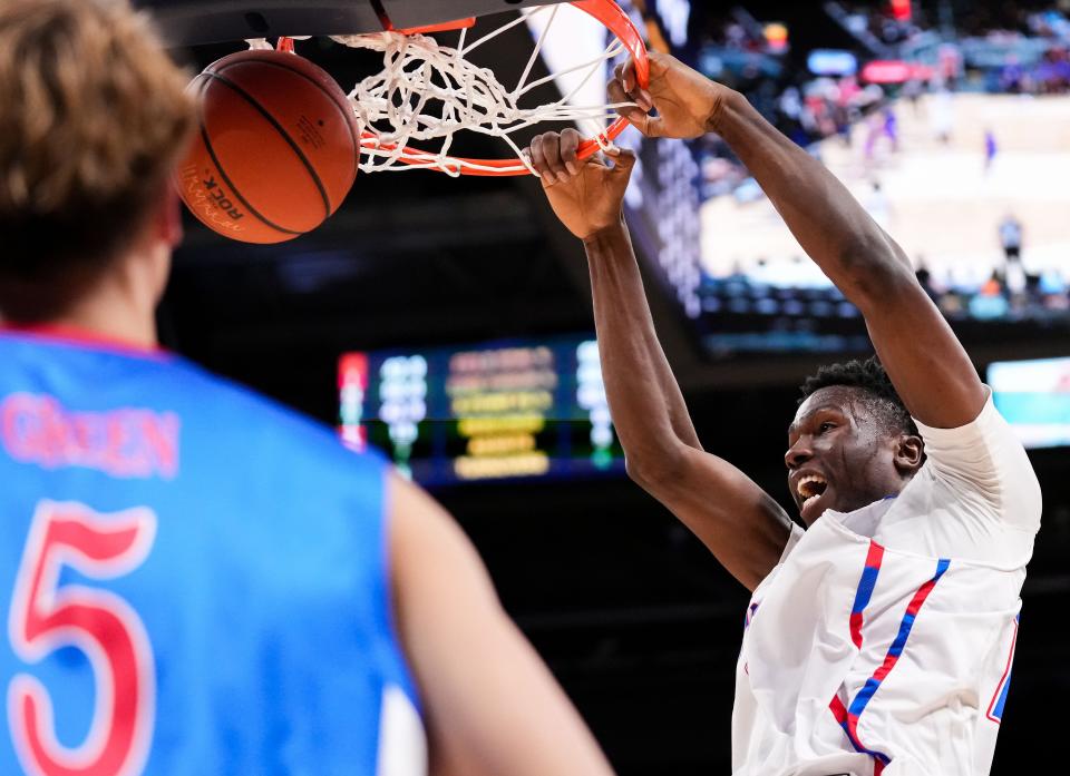 Indiana All-Star Flory Bidunga (1) dunks the ball against Kentucky All-Star Max Green (5) on Saturday, June 8, 2024, during the boys seniors All-Star game at Gainbridge Fieldhouse in Indianapolis. Indiana All-Stars defeated the Kentucky All-Stars.