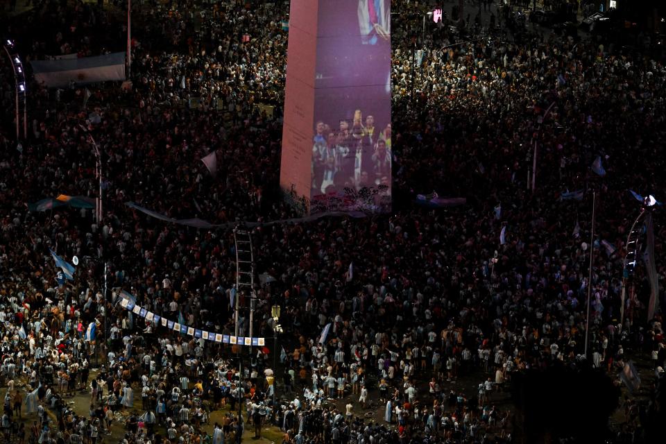 In this aerial view fans of Argentina celebrate at the Obelisk after winning the Qatar 2022 World Cup against France in Buenos Aires on December 18, 2022. (Photo by Luis ROBAYO / AFP) (Photo by LUIS ROBAYO/AFP via Getty Images)