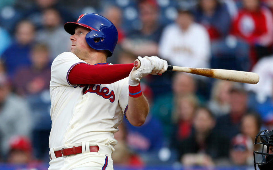 Philadelphia Phillies’ Rhys Hoskins has come up with a new way to celebrate launching a home run with some help from his first base coach. (AP Photo)