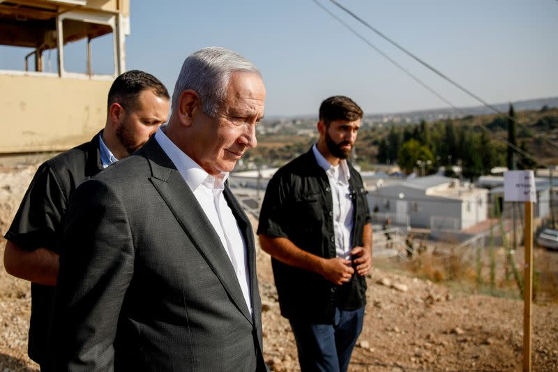 Israeli Prime Minister Benjamin Netanyahu attends a briefing near the Salem military post