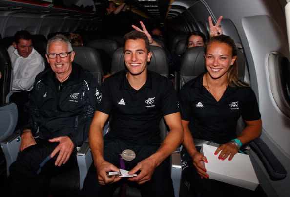 Sarah Walker has some fun behind as Dave Currie, Chef de Mission (L), sailor Blair Tuke and kayaker Lisa Carrington (R) travel on Jetstar to the New Zealand Olympic homecoming ceremony at Pioneer Stadium on August 24, 2012 in Christchurch, New Zealand. (Photo by Sandra Mu/Getty Images)