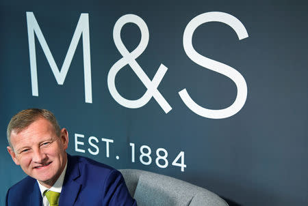 FILE PHOTO: Steve Rowe, CEO of Marks and Spencer, poses for a photograph at the company head office in London, Britain, November 30, 2016. REUTERS/Toby Melville/File Photo
