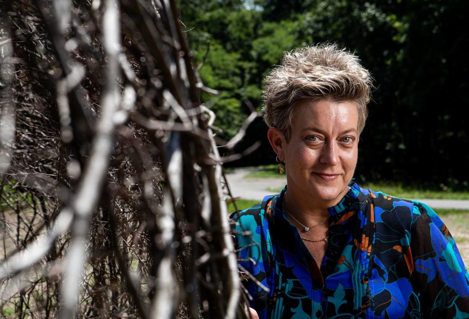 Jenny Zeller is the Arts in Nature Curator at Bernheim Forest, where she also oversees the Artist in Residence program. Zeller is standing at one of Bernheim's lates art installations, OXYGEN, by Netherland artists AKUNZO (Aris de Bakker and Karola Pazarro). Created out of steel and American beech branches collected from Bernheim’s forest, depicting the silhouette of a human face looking up to the sky. July 14, 2023