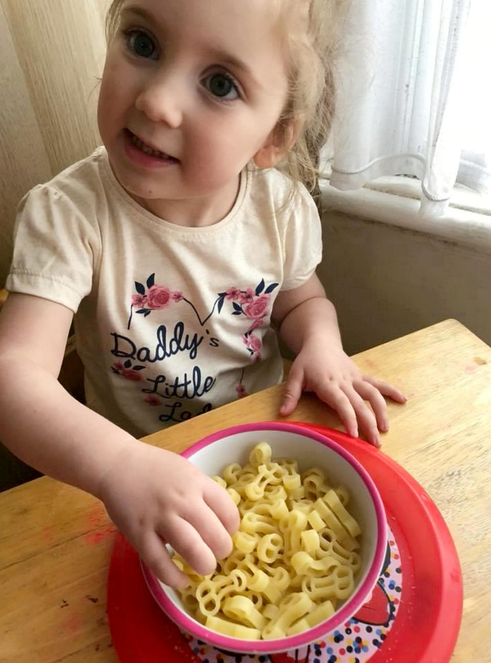 Daughter Ava tucks into her penis pasta [Photo: SWNS]