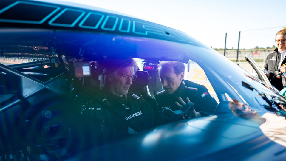 Automotive journalist Angus Mackenzie sits in the cockpit of the 2024 Mercedes-AMG GT2 during his orientation to the car.