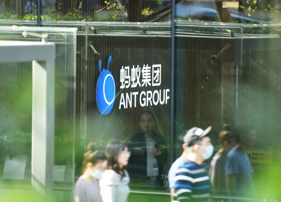 HANGZHOU, CHINA - NOVEMBER 04: People walk by the Ant Group's headquarters on November 4, 2020 in Hangzhou, Zhejiang Province of China. (Photo by Long Wei/VCG via Getty Images)