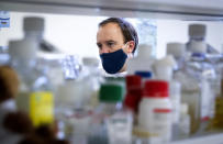 Britain's Health Secretary Matt Hancock during a visit to the Centre for Virus Research at Glasgow University in Glasgow, Scotland, Thursday March 4, 2021. Regulators in the U.K. and four other countries said Thursday, they plan to fast-track the development and authorisation of modified COVID-19 vaccines to ensure drugmakers are able to move swiftly in targeting emerging variants of the coronavirus disease. (Jane Barlow/PA via AP)