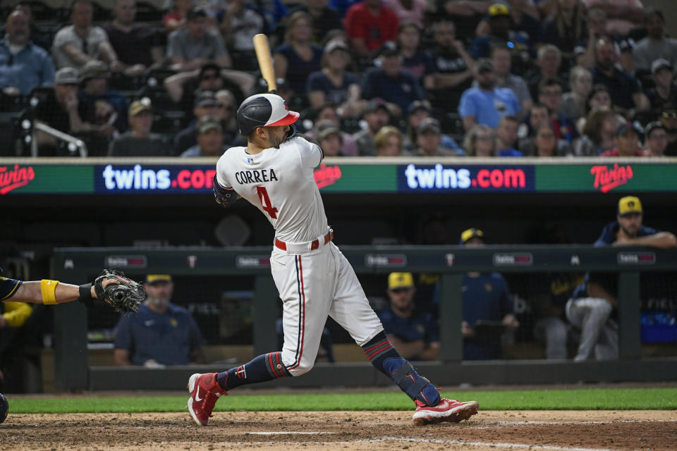 Minnesota Twins' Carlos Correa hits a walk off two-run home run against the Milwaukee Brewers during the ninth inning of a baseball game, Tuesday, June 13, 2023, in Minneapolis. Twins won 7-5. (AP Photo/Craig Lassig)