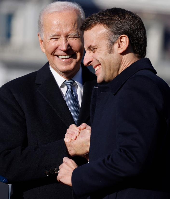 President Joe Biden and French President Emmanuel Macron shake hands during a welcoming ceremony for Macron on the White House South Lawn on Thursday.