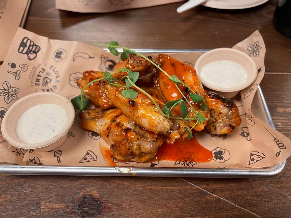 Wings in hot honey sauce with peppercorn ranch are a new appetizer at Flour Girl and Flame in West Allis. The wings are cooked sous vide before being finished in the wood-burning oven.