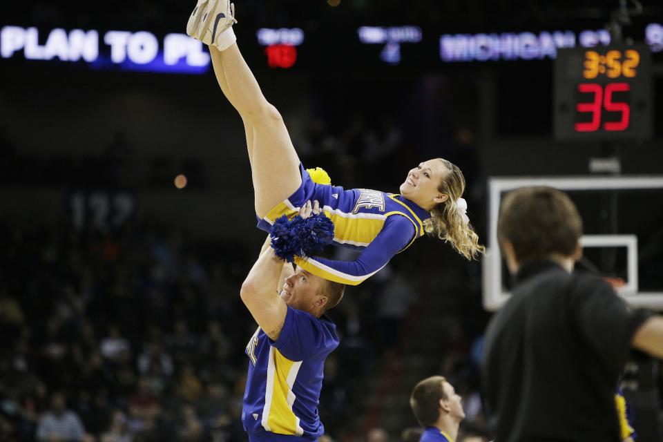 Delaware’s cheerleaders perform during the second-round game of the NCAA men's college basketball tournament against Michigan State, in Spokane, Wash., Thursday, March 20, 2014. (AP Photo/Young Kwak)