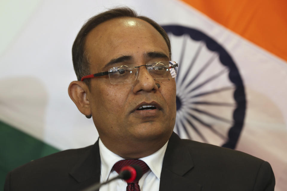 Government spokesperson Rohit Kansal addresses a press conference, sits beside him in Srinagar, Indian controlled Kashmir, Saturday, Oct. 12 2019. The Indian government on Saturday announced that all post paid mobile phone will be restored on Oct. 14, 70 days after a communication blockade was put in place in disputed Kashmir. (AP Photo/Dar Yasin)