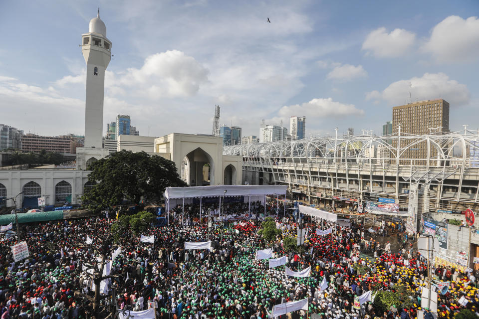 Bangladesh's ruling Awami League supporters shout slogans as they gather for a peace rally in Dhaka, Bangladesh, Friday, July 28, 2023. Thousands of supporters of Bangladesh's governing and opposition parties have held separate rallies over who should oversee the next general election, expected to be held early next year. Despite huge crowds, both rallies were peaceful, with a large security presence. (AP Photo/Mahmud Hossain Opu)