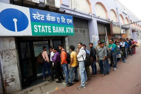 People queue outside an ATM of State Bank of India (SBI) to withdraw money in Kolkata, November 22, 2016. REUTERS/Rupak De Chowdhuri/Files