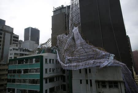 Several buildings were damaged by the typhoon including this one in Wanchai district, which had its bamboo scaffolding collapse. (Photo by: Reuters)