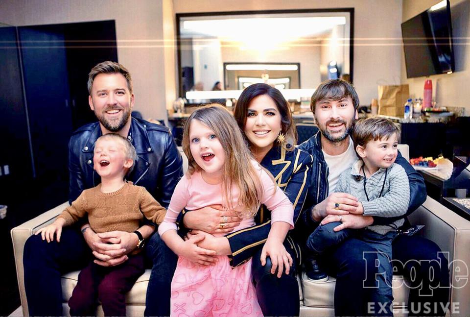 Lady A <a href="https://people.com/country/lady-antebellum-vegas-residency-lyrics-adjustment-kids/" rel="nofollow noopener" target="_blank" data-ylk="slk:makes it a family affair;elm:context_link;itc:0;sec:content-canvas" class="link ">makes it a family affair</a> as their children pop-in for a quick photo before showtime. (L-R Charles, Ward, Hillary, Eisele, Dave, Cash.)