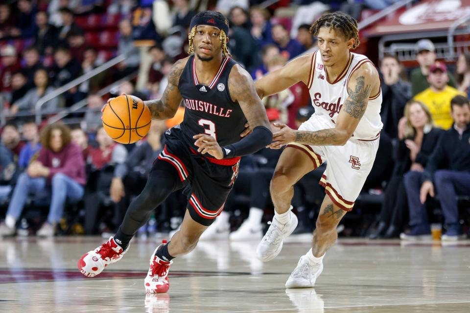 Louisville guard El Ellis (3) is guarded by Boston College guard Makai Ashton-Langford (11) during the second half of an NCAA college basketball game Wednesday, Jan. 25, 2023, in Boston. (AP Photo/Greg M. Cooper)