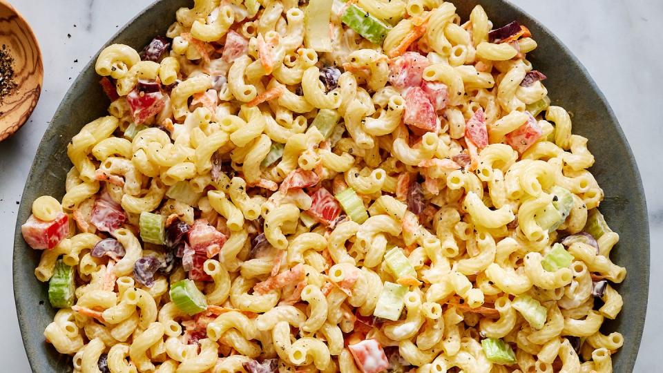 creamy macaroni salad with carrots, celery, and olives