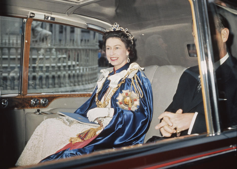 Queen Elizabeth II and Prince Philip attend a service for the Order of St Michael and St George at St Paul's Cathedral, London, 24th July 1968. The Queen is wearing the Star of the Order, which bears the motto 'Auspicium Melioris Aevi'.  (Photo by Hulton Archive/Getty Images)