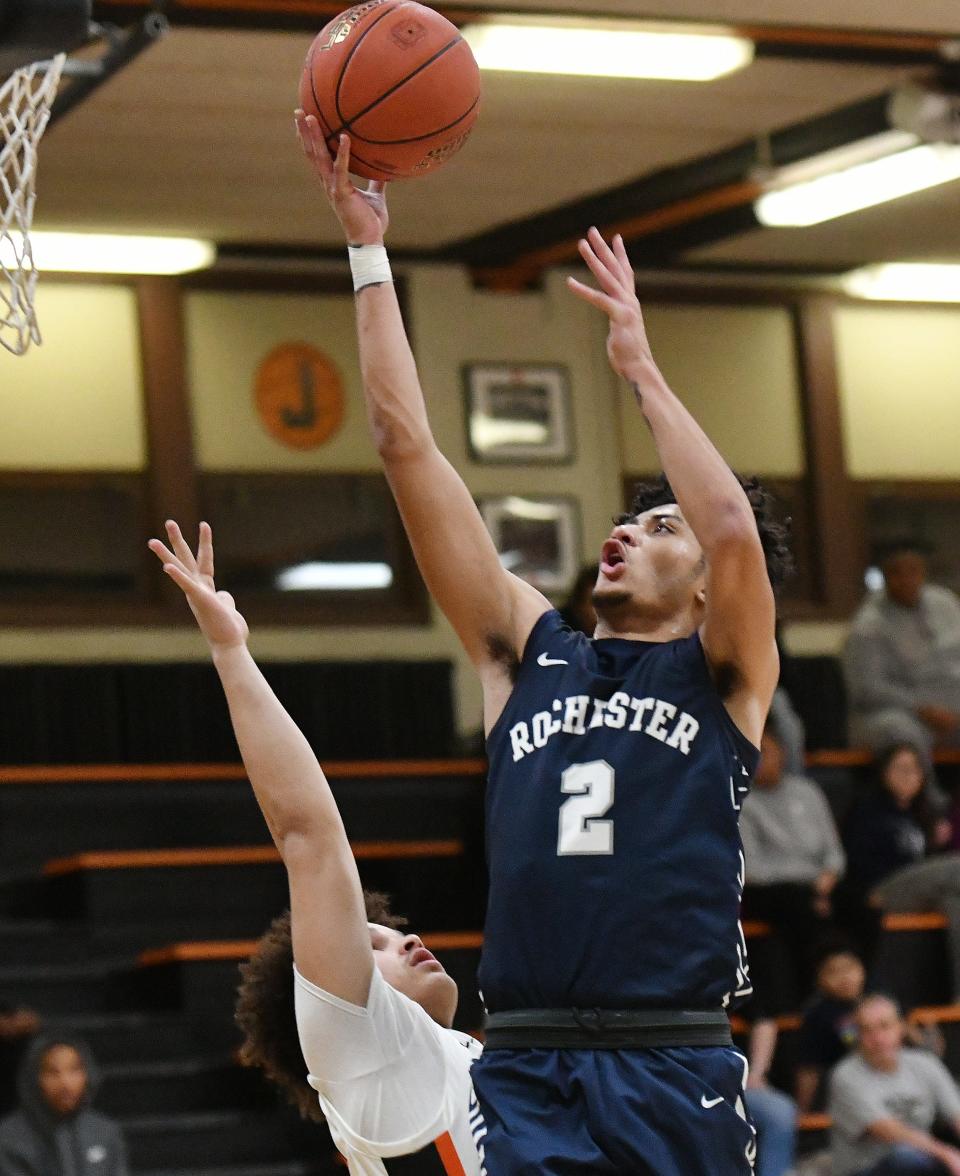 Rochester's Jerome Mullins shoots over Beaver Falls' Damien Jones during a Jan. 23, 2023, game at Beaver Falls.