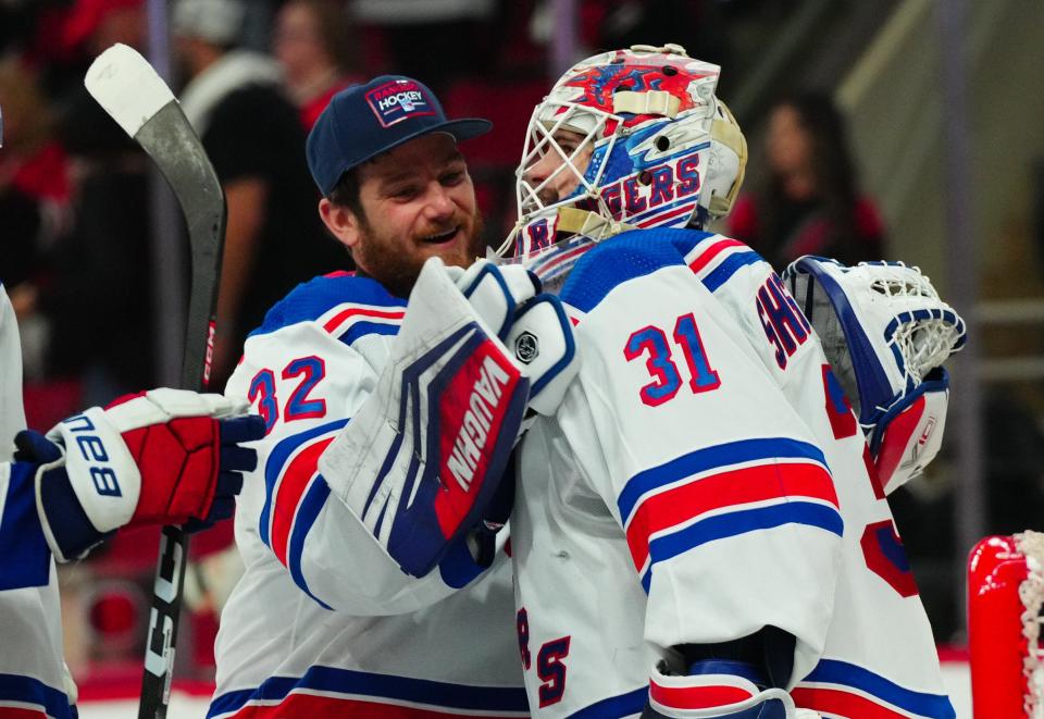 May 16, 2024; Raleigh, North Carolina, USA; New York Rangers goaltender Igor Shesterkin (31) and goaltender Jonathan Quick (32) celebrate their victory against the Carolina Hurricanes in game six of the second round of the 2024 Stanley Cup Playoffs at PNC Arena.